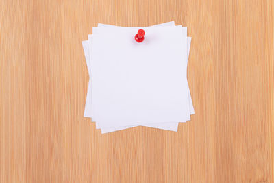 Close-up of empty paper on wooden table