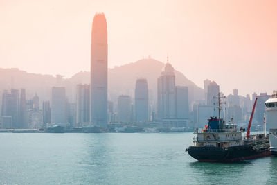 Panoramic view of sea and buildings against sky