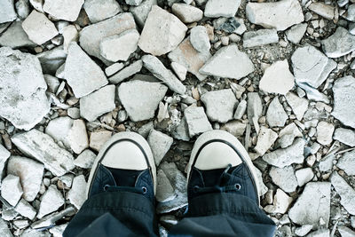 Low section of man standing on footpath