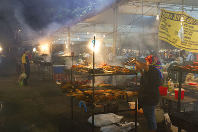 People standing at market stall