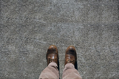 Low section of man standing on floor