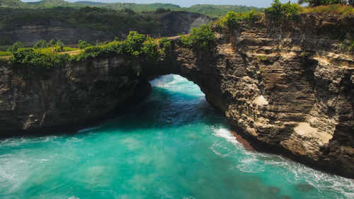 High angle view of rocks by sea