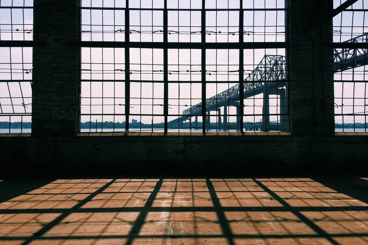 architecture, window, built structure, urban area, day, no people, indoors, sunlight, nature, glass, iron, shadow, metal, pattern, sky, reflection, grid, facade, building