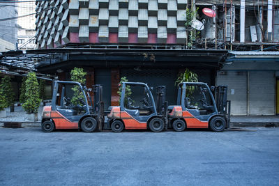 Fork lift trucks parked on empty street in the patpong area of bangkok