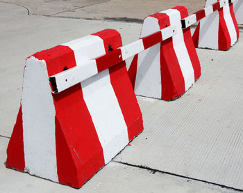 High angle view of red barriers on footpath