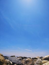 Scenic view of landscape against blue sky