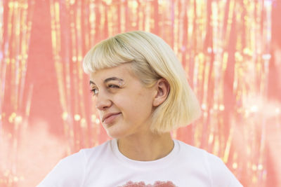 Portrait of young woman looking away