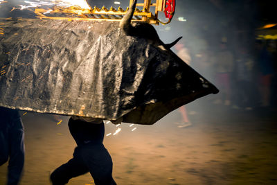 Man walking on street during rainy season