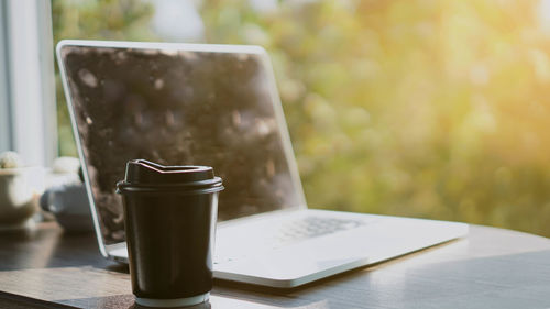 Close-up of coffee cup on table