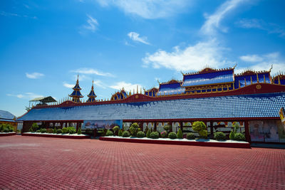 View of temple building against cloudy sky