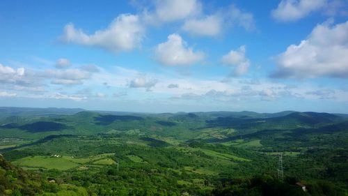 Scenic view of mountains against cloudy sky