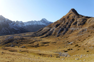 Scenic view of rocky mountains against clear sky