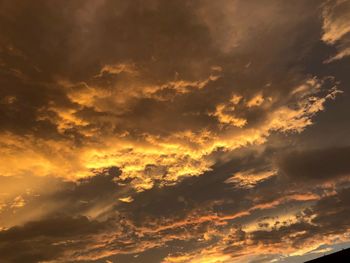 Low angle view of dramatic sky during sunset