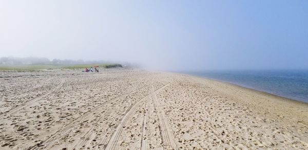 Scenic view of beach against clear sky