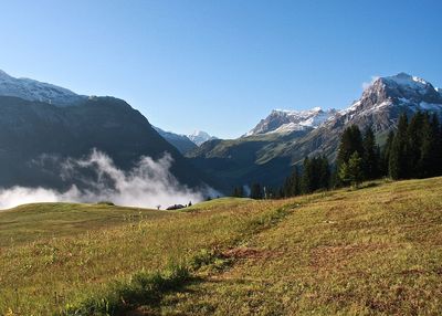 Idyllic shot of mountains against blue sky