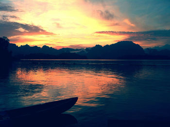 Scenic view of lake at sunset