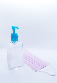 Close-up of drink in bottle against white background