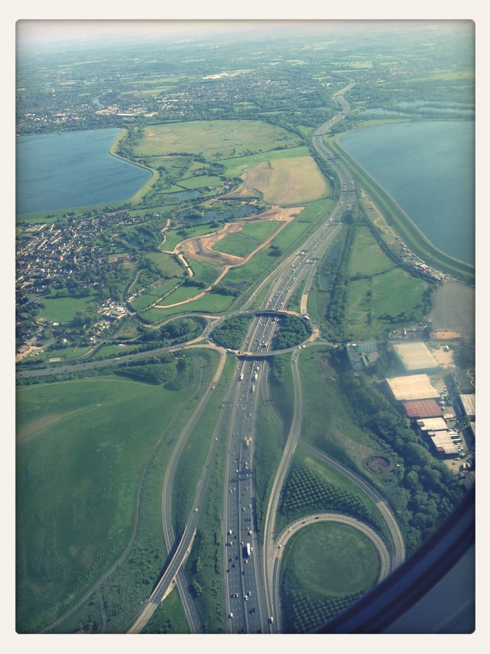 aerial view, transfer print, high angle view, transportation, auto post production filter, sea, cityscape, city, water, mode of transport, landscape, elevated view, built structure, architecture, travel, crowded, nature, scenics, road, building exterior