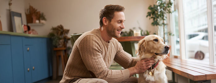 Side view of man with dog