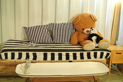 Stuffed toy on sofa at home