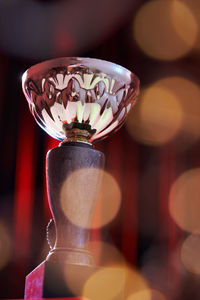 Close-up of wineglass on glass table