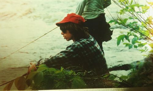 Close-up of woman standing in pond