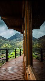 Scenic view of mountains seen through bridge