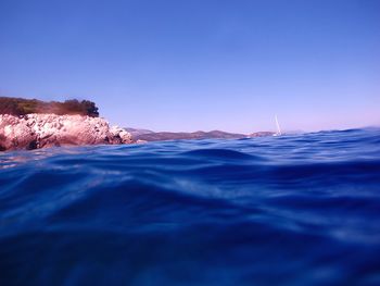 Scenic view of sea against clear sky