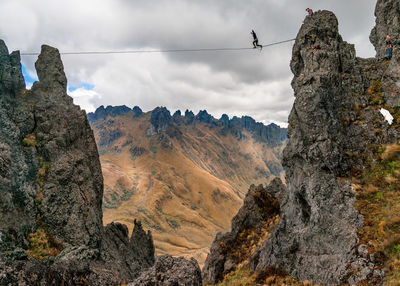 Low angle view of rock formations against sky