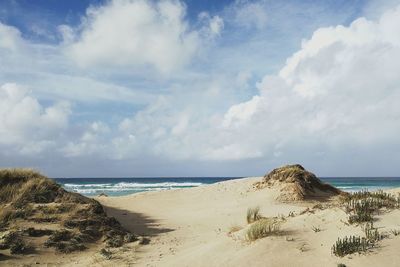 Scenic view of beach against sky