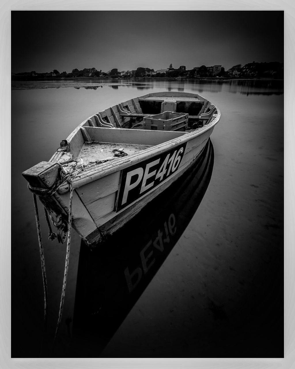 NAUTICAL VESSEL MOORED ON SEA AGAINST SKY