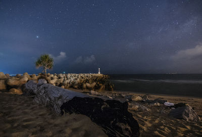 Scenic view of sea against sky at night