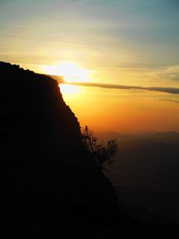 Scenic view of silhouette mountain against sky during sunset