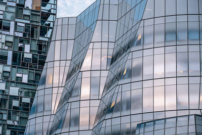 Low angle view of modern buildings against sky