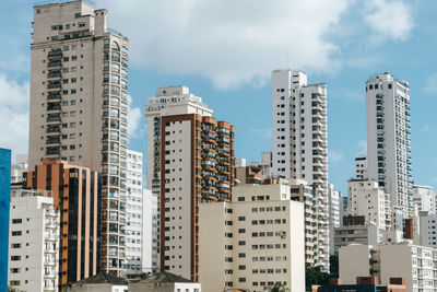 Buildings in big city against sky