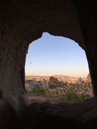 Scenic view of landscape seen through arch