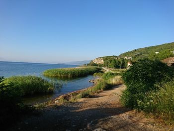 Scenic view of sea against clear blue sky