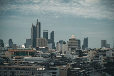 Modern buildings in city against sky