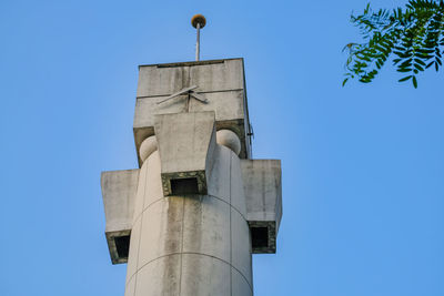 Low angle view of tower against clear blue sky