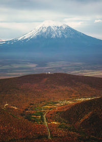 Scenic view of snowcapped mountains against sky