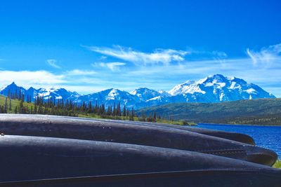 Scenic view of mountains against blue sky