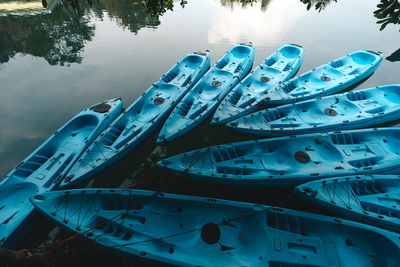 High angle view of sailboats moored in lake