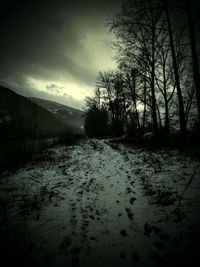 Scenic view of landscape against cloudy sky