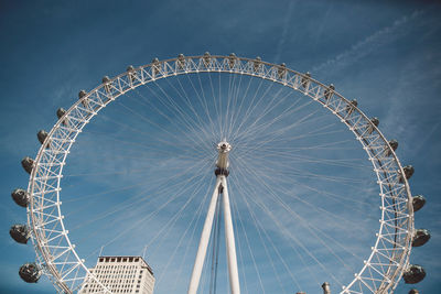 Low angle view of ferris wheel against sky