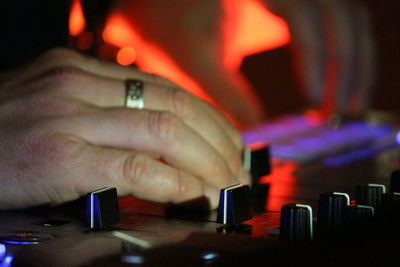 Cropped image of hand holding guitar