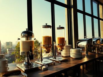 Close-up of coffee served on table against window