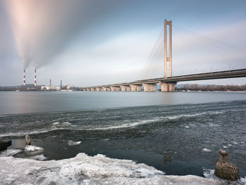 Pivdennyi bridge over dniester river against sky