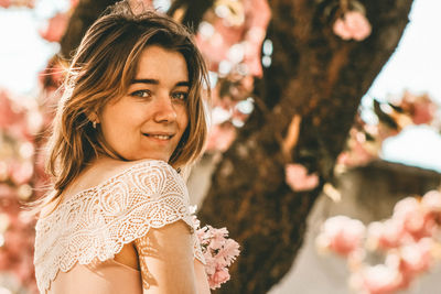 Portrait of beautiful woman with flowers