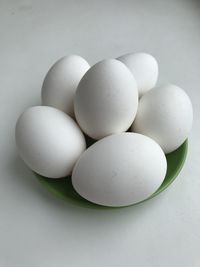 High angle view of eggs in container on table