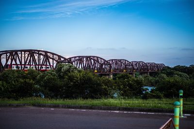 View of bridge against cloudy sky